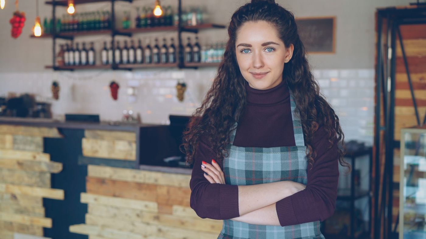 A small-business founder in their café